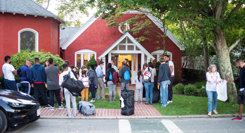 Venezuelan migrants stand outside St. Andrew's Church in Edgartown, Massachusetts, U.S. September 14, 2022