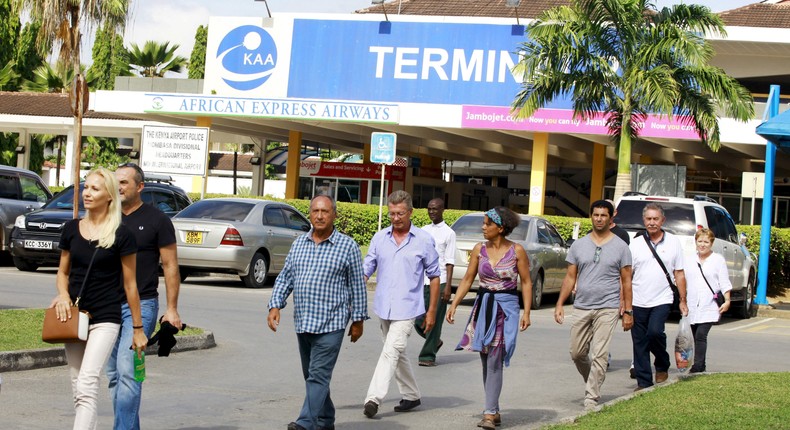 Passengers who were onboard an Air France Boeing 777 aircraft that made an emergency landing are escorted from Moi International Airport in Kenya's coastal city of Mombasa, December 20, 2015.