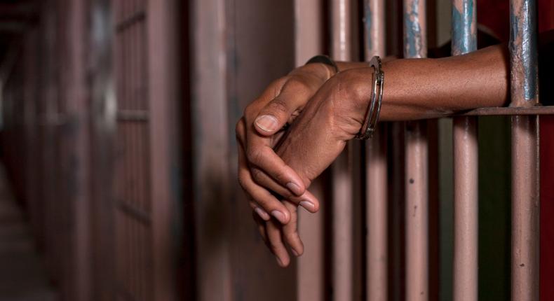 Handcuffed man in prison (Illustration purpose / loopJamaica)