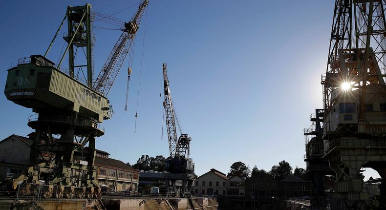 In this photo taken Oct. 2, 2014, the sun begins to go down behind the former Mare Island Naval Shipyard in Vallejo, Calif.