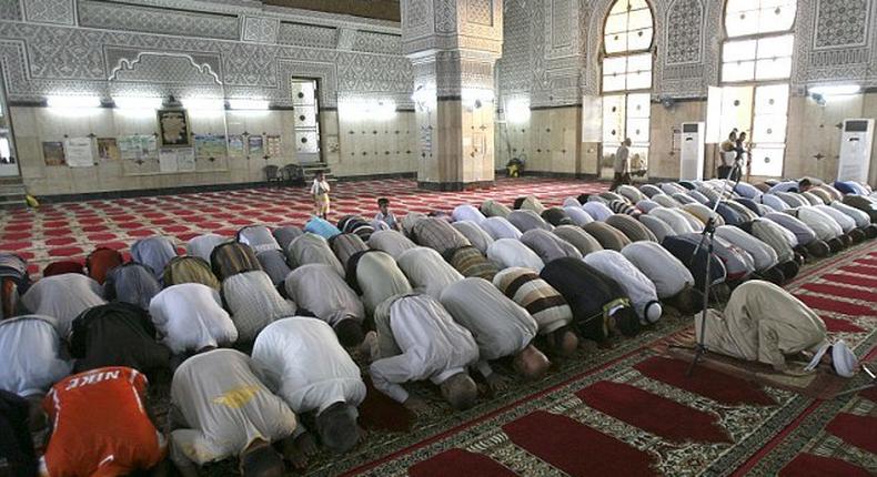 Worshippers praying in a mosque.