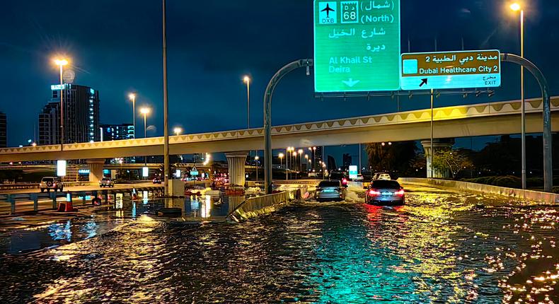 Motorisits drive along a flooded street following heavy rains in Dubai.GIUSEPPE CACACE/Getty