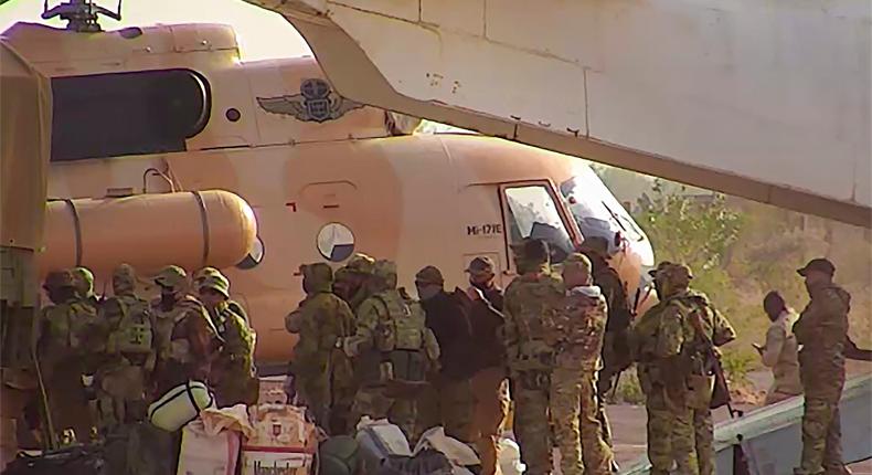 This undated photograph handed out by the French military shows Russian mercenaries boarding a helicopter in northern Mali.French Army via AP