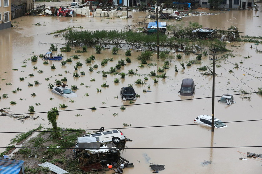 Cars are partially submerged in floodwaters after Typhoon Lekima hit Dajing town in Wenzhou, Zhejian