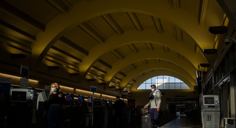 Masked travelers at John Wayne Airport in Santa Ana, California.
