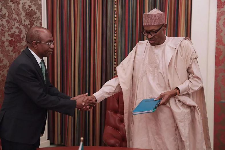 CBN Governor, Mr. Godwin Emefiele and President Buhari during a meeting (Presidency) 