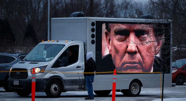 A digital billboard truck sponsored by the Lincoln Project outside a New Hampshire Trump rally on January 19, 2024.Getty Images News/Getty Images