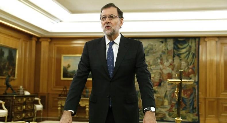 Spain's newly re-elected Prime Minister Mariano Rajoy swears an oath during a royal decree ceremony at the Zarzuela Palace in Madrid, on October 31, 2016