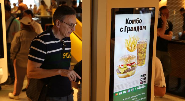 A customer uses a screen at a former McDonald's outlet in Russia.