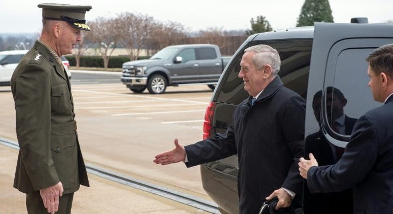 US Secretary of Defense James Mattis (R) arrives at the Pentagon on January 21, 2017