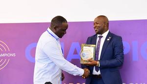 Next Media Group CEO Kin Kariisa (left) receiving the accolade at the 99th District 9214 Rotary Leadership Conference held in Munyonyo.
