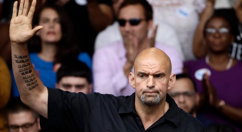 In this Sept. 21, 2018 photo, former Braddock, Pa., Mayor John Fetterman speaks at a campaign rally for Pennsylvania candidates in Philadelphia