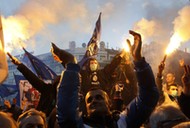 Supporters of Serbian ultra-nationalist leader Seselj light flares during an anti-government rally B