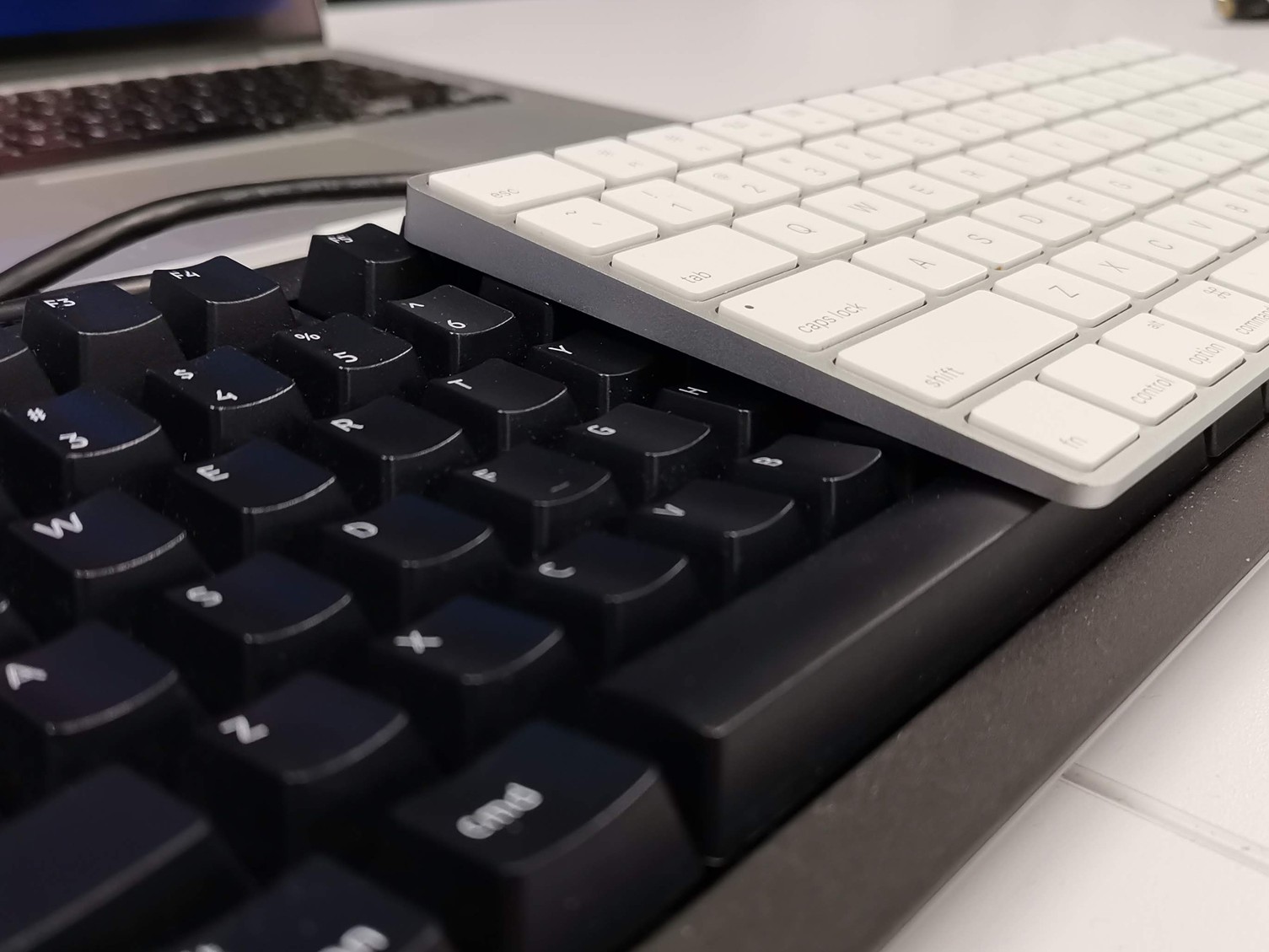 This large, chunky keyboard with an ugly wire sticking out of it is
