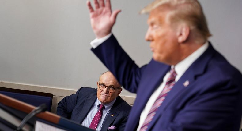 Rudy Giuliani listening as President Donald Trump spoke at a news conference in the White House on September 27.