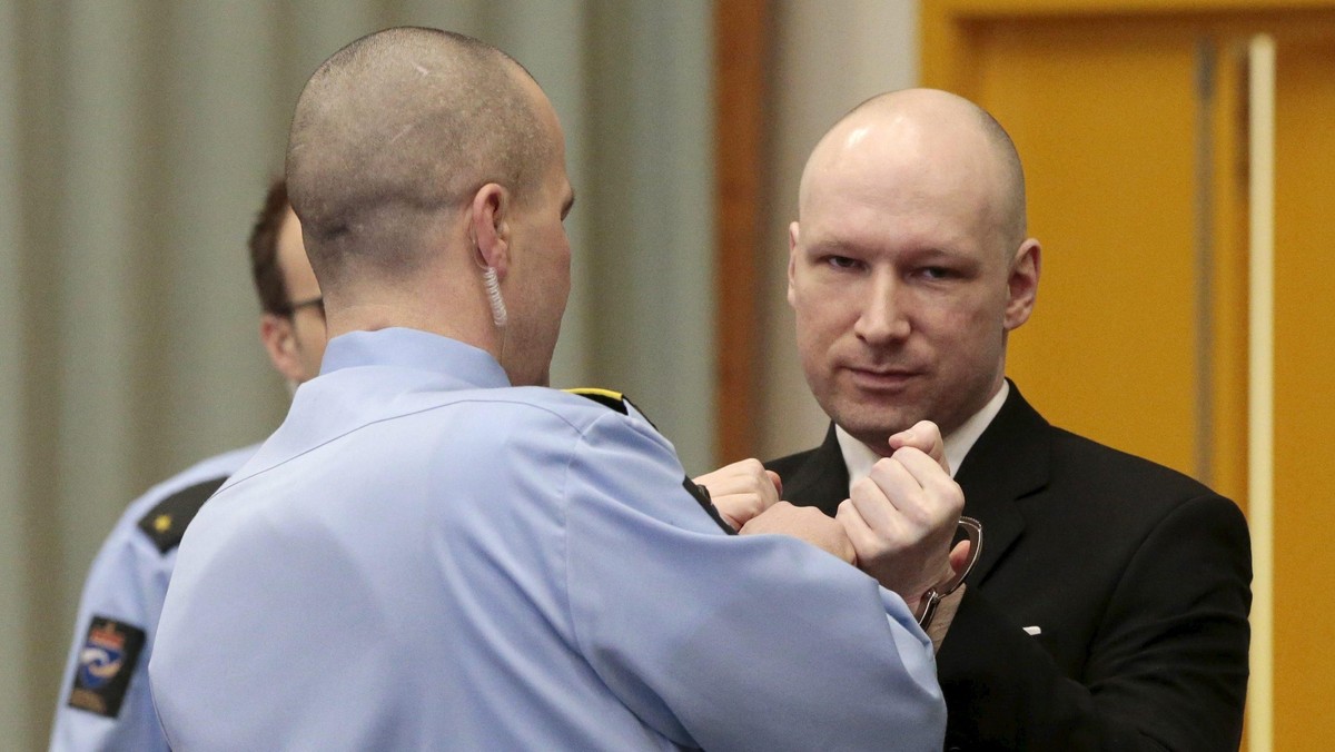 Mass killer Anders Behring Breivik has his handcuffs removed upon his arrival at the court room in S