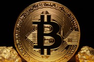 Golden Bitcoin Coin and mound of gold on black background