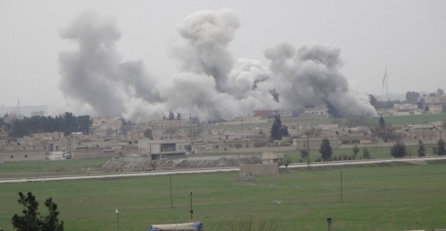 Smoke rises over the northern Syrian town of Tel Abyad as it is pictured from the Turkish border town of Akcakale, in Sanliurfa province