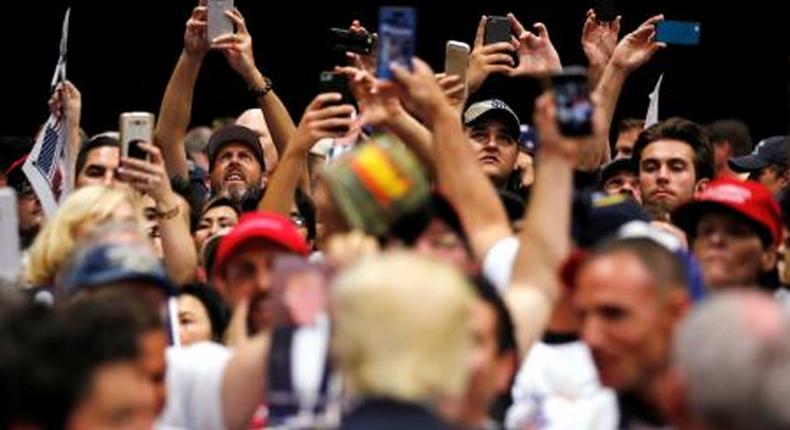 Republican U.S. presidential candidate Donald Trump signs autographs after a rally with supporters in San Diego, California, U.S. May 27, 2016.