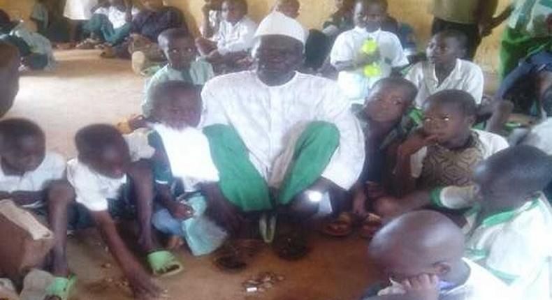 Sarkin Lambu and other pupils in their classroom