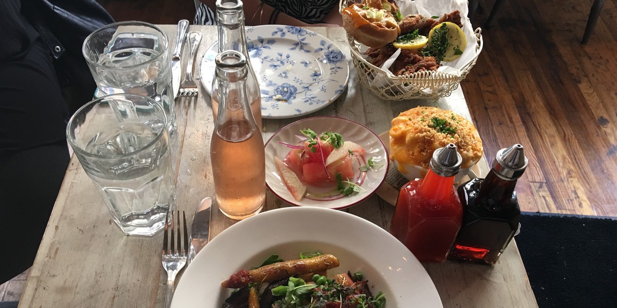 Short rib meatloaf, chicken and waffles, watermelon salad, and mac 'n' cheese at Root & Bone in Manhattan's East Village.