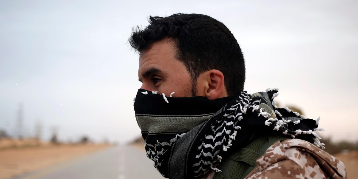 A fighter from Misrata stands at a checkpoint near Sirte March 16, 2015.