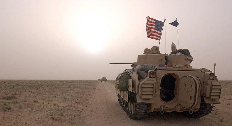 US Army 3rd Division 3-7 Bradley fighting vehicles took up a position along a road on March 19, 2003, inside the demilitarized zone between Kuwait and Iraq.Scott Nelson