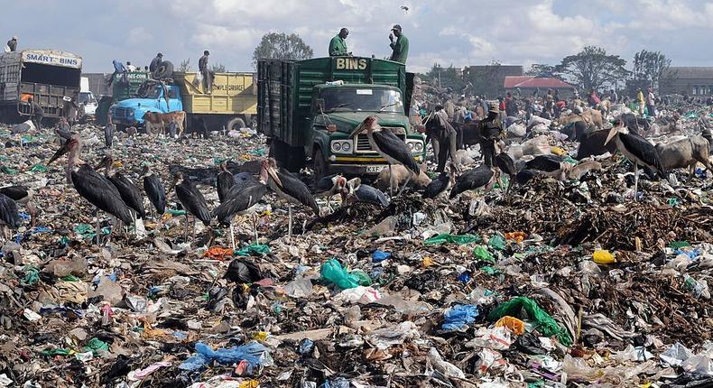 Garbage trucks arrive on December 10, 2009, at the Dandora dump in Nairobi. (Photo by SIMON MAINA/AFP via Getty Images)