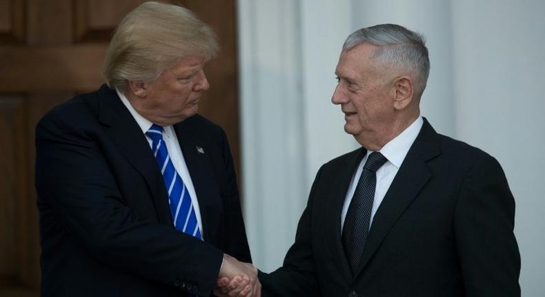 Donald Trump shakes hands with retired United States Marine Corps general James Mattis after their meeting at Trump International Golf Club, November 19, 2016 in Bedminster Township, New Jersey