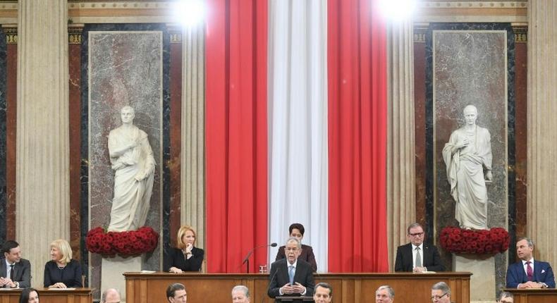 Austrian Alexander Van der Bellen (C) speaks alongside ministers during his swearing-in ceremony at the federal assembly in parliament in Vienna on January 26, 2017