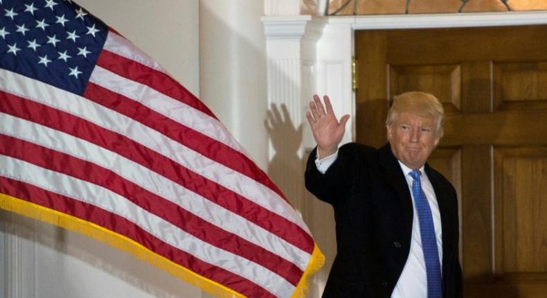 President-elect Donald Trump waves to the media from the steps at the clubhouse of Trump National Golf Club on November 20, 2016 in Bedminster, New Jersey