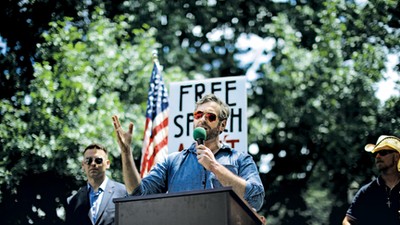 Mike Cernovich speaks during a rally about free speech outside of the White House in Washington