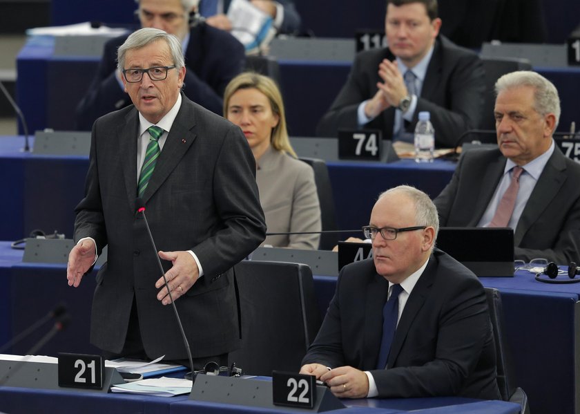 European Commission President Juncker talks to First Vice-President of the Commission Timmermans, ah