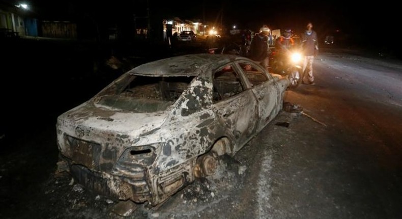 File image of a torched car during a past accident with an oil tanker