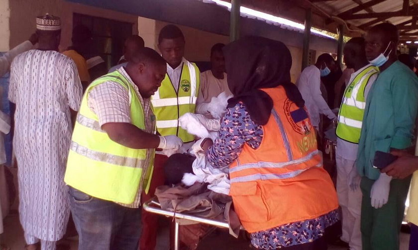 A man inspects the damage inside a mosque at the site of a suicide bomber attack in Mubi in Adamawa 