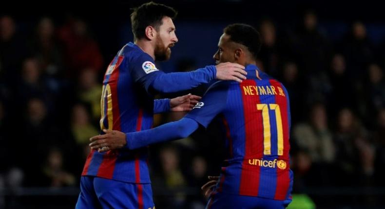 Barcelona's forward Lionel Messi (L) celebrates with Neymar after scoring on January 8, 2017