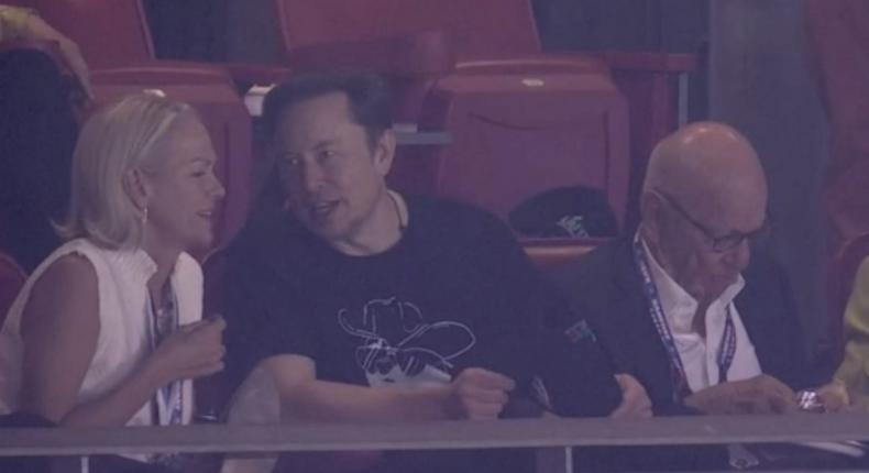 Elon Musk sits between Elisabeth Murdoch and Rupert Murdoch at the Super Bowl on Feb 12.Fox