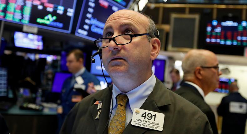 FILE - In this Tuesday, Aug. 13, 2019, file photo trader Andrew Silverman works on the floor of the New York Stock Exchange. The threat of a recession doesn't seem so remote anymore, and stocks sank Wednesday after the bond market threw up one of its last remaining warning flags on the economy's health. (AP Photo/Richard Drew, File)