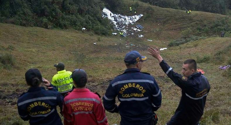 Rescuers look at the wreckage of the LAMIA Airlines charter plane that carried members of the Chapecoense Real football team, in the mountains of Cerro Gordo in Colombia, on November 29, 2016