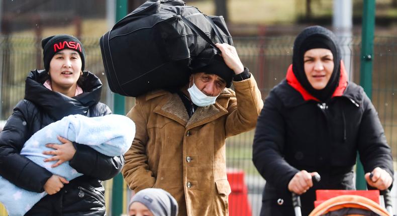 People fleeing from Ukraine are seen after crossing Ukrainian-Polish border due to Russian military attack on Ukraine.