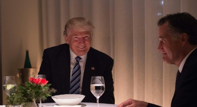 US President-elect Donald Trump (L) dines with Mitt Romny (R) at Jean-Georges restaurant on November 29, 2016 in New York