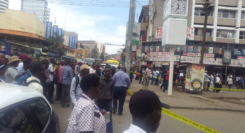 Nairobi residents look on as police cordon off an area along Latema Road where a suspicious box was left (Twitter)