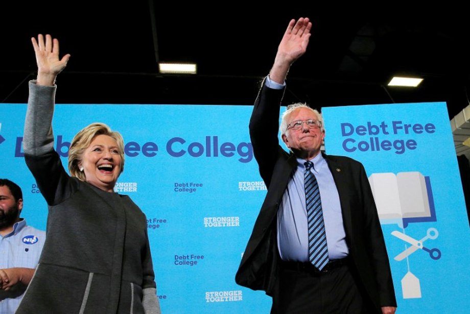 U.S. Democratic presidential nominee Hillary Clinton and U.S. Senator Bernie Sanders take the stage to talk about college affordability during a campaign event at the University of New Hampshire in Durham