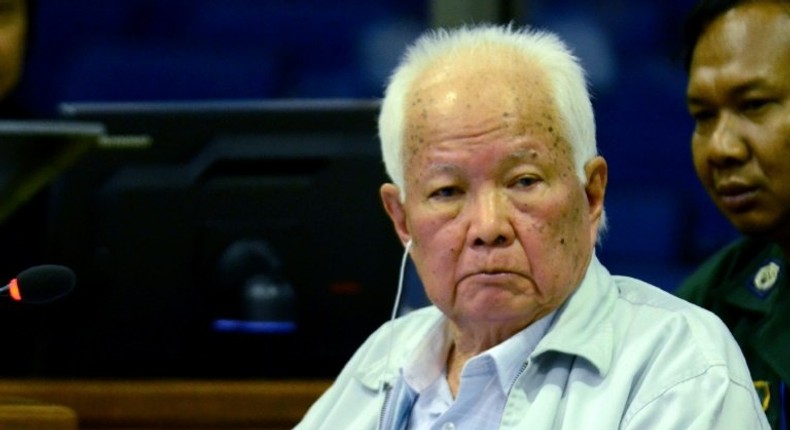 Former Khmer Rouge leader head of state Khieu Samphan (C) denies being part of the killing machine that decimated nearly a quarter of Cambodia's population