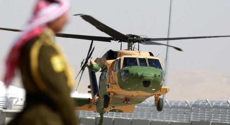 A helicopter carrying Jordan's King Abdullah II arrives at Queen Alia International Airport in Amman on March 28, 2017, ahead of an Arab League summit