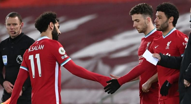 Mohamed Salah (left) is substituted during the English Premier League football match between Liverpool and Chelsea