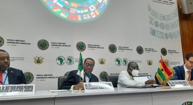 AfDB president Akinwumi Akin Adesina with Ghana's Finance Minister Ken Ofori-Atta singing the deal