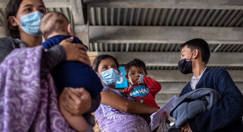 Central American asylum seekers arrive to a bus station after being released by U.S. Border Patrol agents on February 26, 2021 in Brownsville, Texas.
