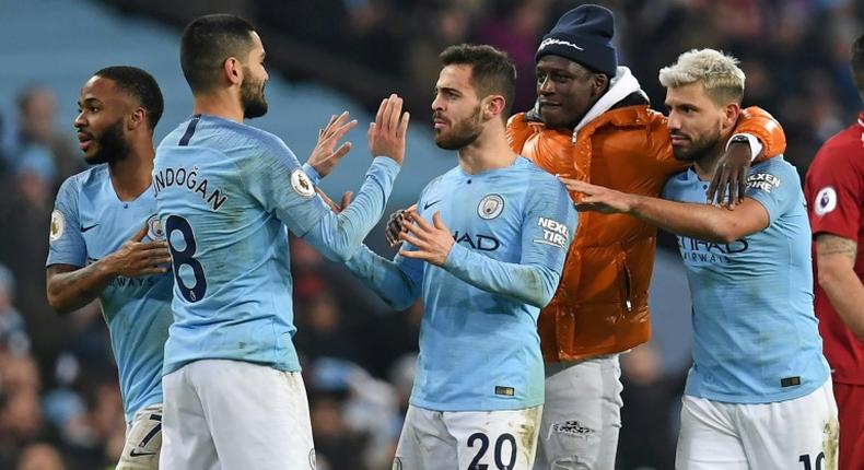 Manchester City's stars celebrate their vital victory over Liverpool