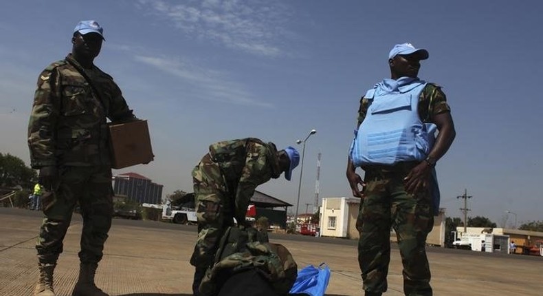 Ghanian U.N. peacekeepers wait for a bus upon arriving in Juba February 28, 2014. REUTERS/Andreea Campeanu